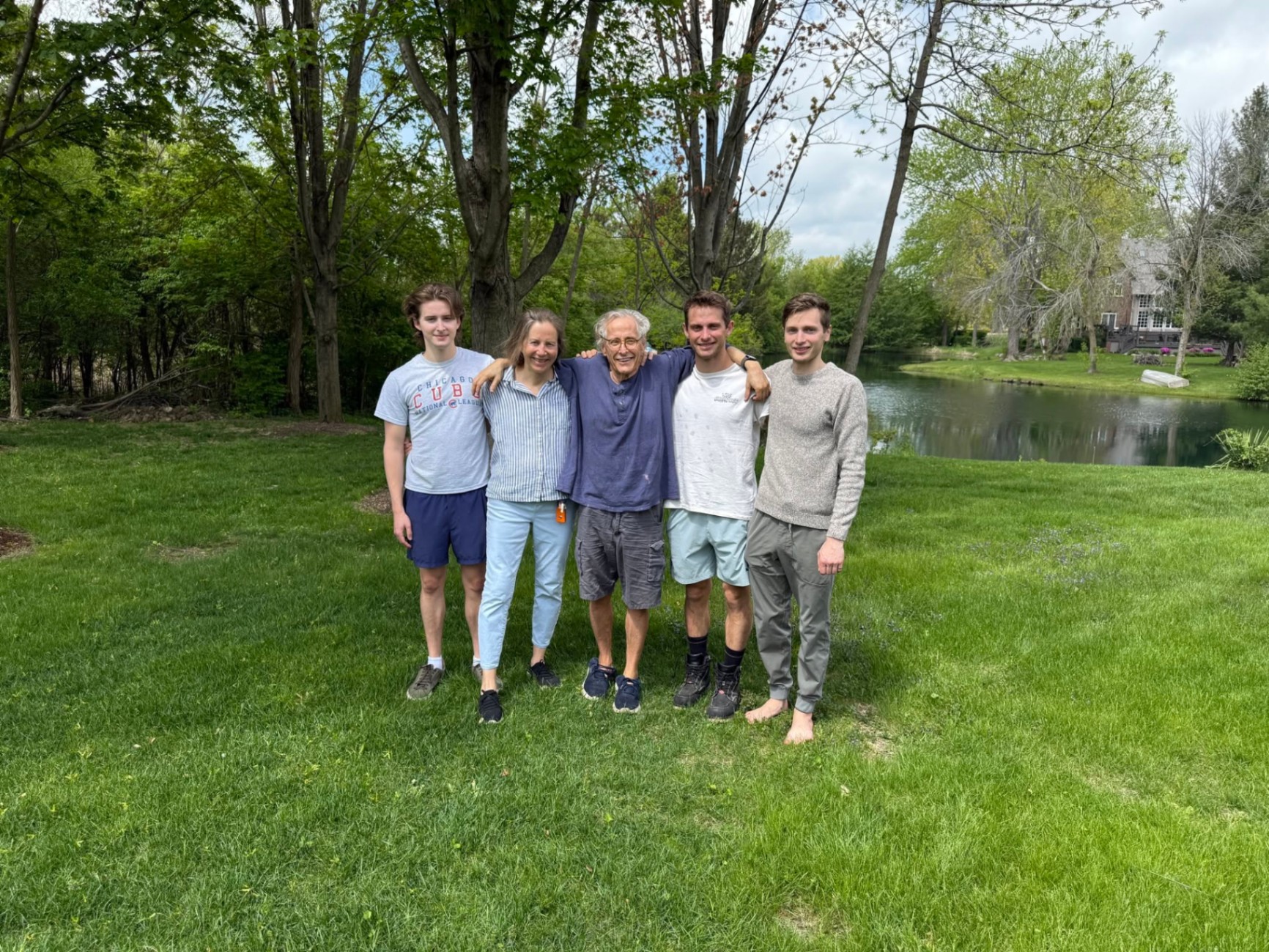 Pierre with his wife and three sons on the lawn near their home.
